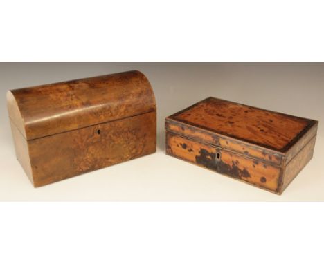 A 19th century burr walnut tea caddy, of rectangular domed form, the hinged cover opening to a central mixing bowl aperture f