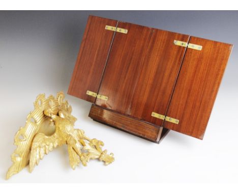 A late 19th/early 20th century giltwood figural wall bracket, modelled as an eagle with wings outstretched upon a fleur de li