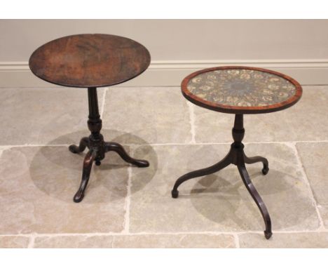 A 19th century mahogany tripod table, the oval glazed top with a floral needlepoint tapestry panel, raised upon a baluster pe