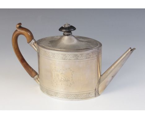 A George III silver teapot, Henry Chawner, London 1792, of oval form with hinged cover, wooden knop and c-scroll handle, brig