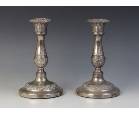 A pair of George IV silver candlesticks, John & Thomas Settle, Sheffield 1823, baluster stems on weighted circular bases, det