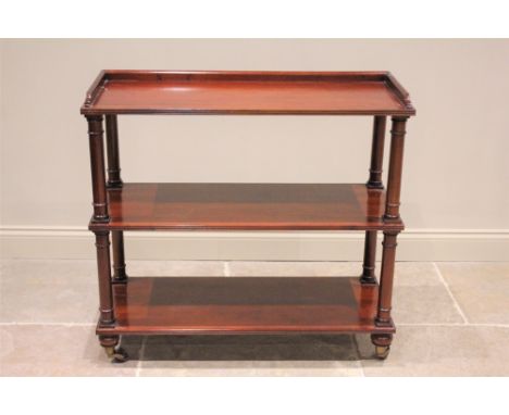 * A 19th century mahogany dumb waiter, the rectangular three quarter galleried top tier, raised upon ring turned cylindrical 