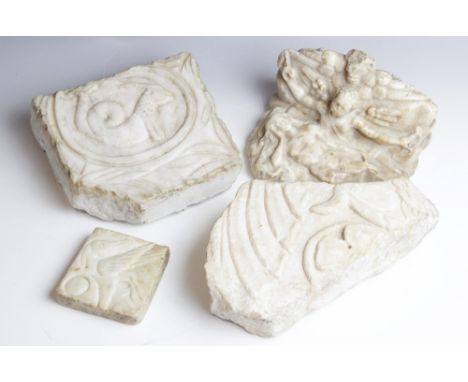 A selection of carved architectural marble fragments, to include a relief carved example depicting a central Capricorn motif 