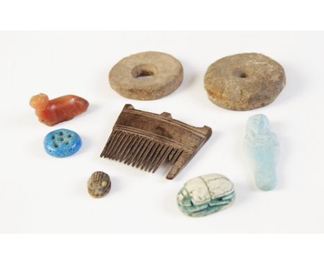 * A small collection of ancient Egyptian and later antiquities, including a wooden hair comb, 52mm wide, a scarab beetle, 27m
