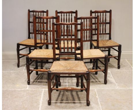 * A harlequin set of eight ash, elm and alder Lancashire spindle back chairs, 19th century, each with two rows of turned spin