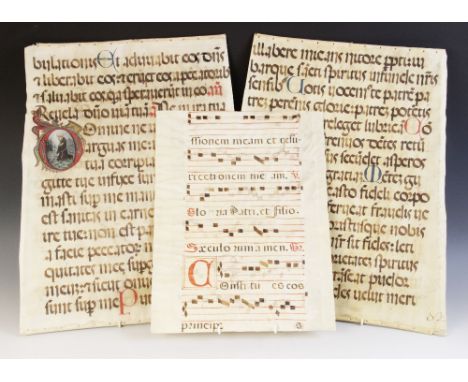 ILLUMINATED PAGES: A double sided illuminated vellum page of large proportions, each side with single column of fifteen lines