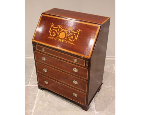* An Edwardian mahogany and satinwood cross banded Sheraton revival bureau, the fall font inlaid with swags and scrolling fol
