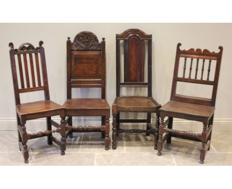 Four assorted Charles II and later oak chairs, to include an arched panel back example with a board seat on baluster turned f