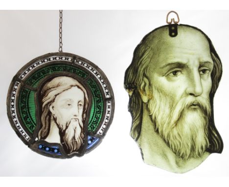 A tondeau stained and painted glass portrait panel, 19th century, depicting the face of Jesus, 20cm diameter, with a further 