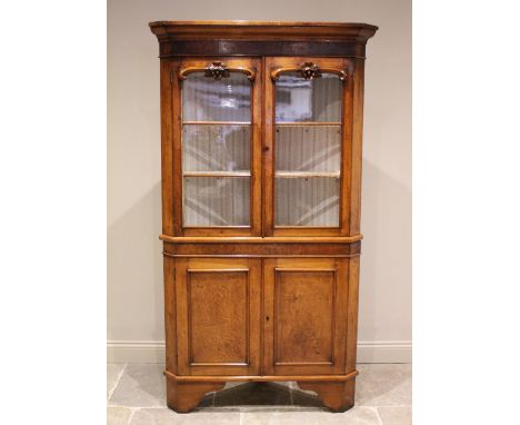 * A 19th century oak and pollard oak freestanding corner cabinet, the moulded cornice above a pollard oak banded frieze and a