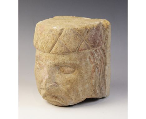 A carved stone corbel, in the medieval style, depicting a gentleman with distinctive hair and hat, 17cm high (at fault)&nbsp;