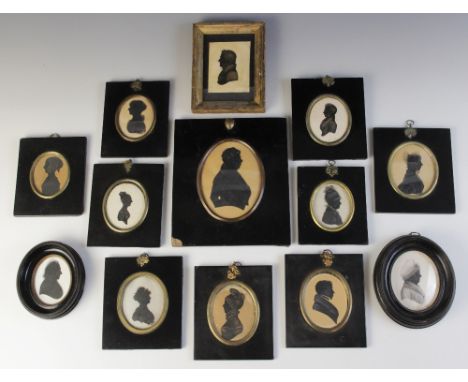 A collection of twelve portrait silhouette miniatures, 19th century and later, variously framed, the largest 21cm x 18.5cm ov