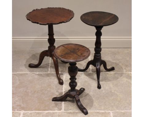 A 19th century mahogany pie crust tripod table, the circular tilt top with moulded and scalloped rim, raised upon a tapering 