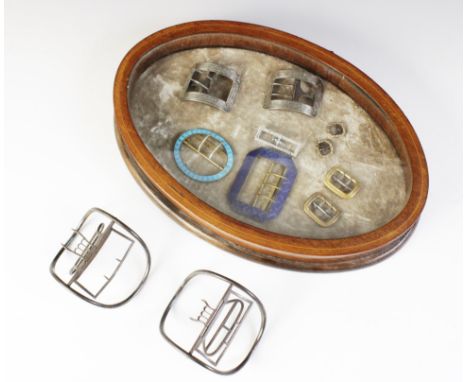 A selection of 19th century and later buckles, to include a silver coloured pair, of curved rectangular form with scrolling f
