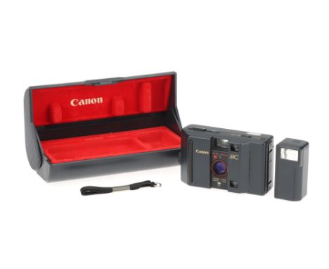 A Canon MC 35mm Compact Camera,grey, body G, some paint chipping to rear, shutter untested, with MC-S flash attachment, also 