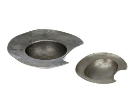 Two Pewter Barber's or Bleeding Bowls,the smaller oval bowl 18th/19th century, with ring for hanging, the small size and cut-