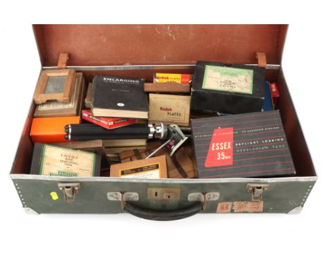 A Travel Trunk Containing Photographic Sundries,to incldue a range of exposed plates, developing tanks, books, &amp; more,