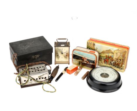 A Collector's Lot,to contain an Electricon No.6, a bakelite barometer, two printed tins, a Smiths carriage clock, &amp; a gla
