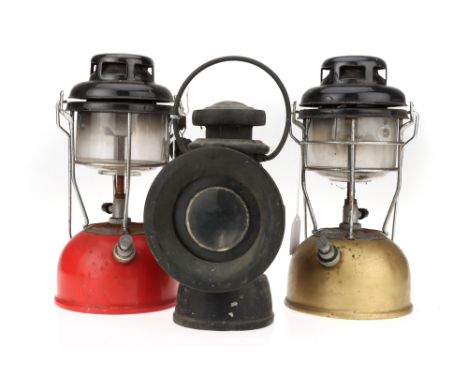 Lucas King of the Road Automobile Lamp,no. 651, refinished in black; together with two Tilly lamps in gold and red (3)