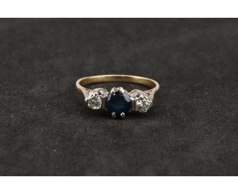 Diamond and Sapphire Three Stone Dress Ring,on 15 ct expandible strap, the case 2.5 cm dia. 25.5 g gross