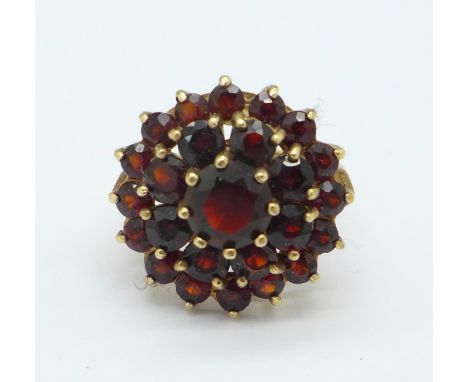 A 9ct gold and garnet cluster ring, 5.8g, M