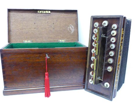 A Victorian accordion in original box, with label marked Winrow, Hollow Stone, Nottingham, with inlaid frame and mother of pe