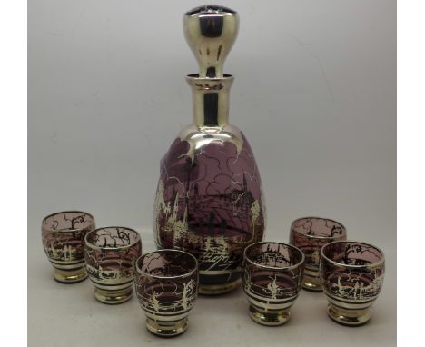 An amethyst glass decanter and six glasses with applied silver decoration, the decanter depicting a courting couple