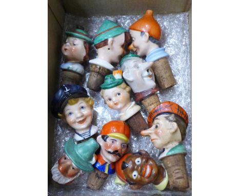 A collection of ten figural ceramic bottle pourers