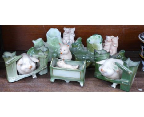 A group of five ceramic pig figurines
