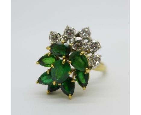 An 18ct gold, diamond and green stone ring, 6.4g, R