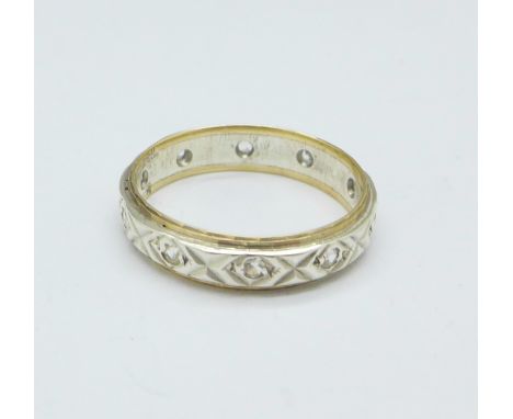 A 9ct gold, silver and white stone eternity ring, O