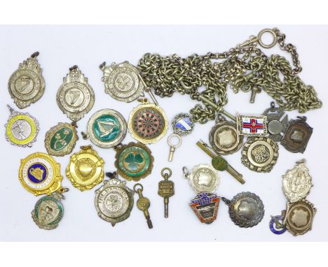 A silver and enamel RNLI badge, a silver NUR badge, six silver fobs, a silver chain, other chains, fobs and a Kendal &amp; De