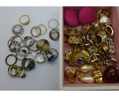 Approximately twenty pairs of vintage clip-on earrings and costume rings