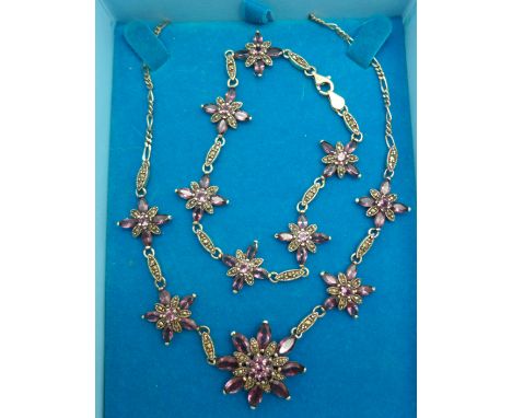 A silver amethyst and marcasite necklace and matching bracelet