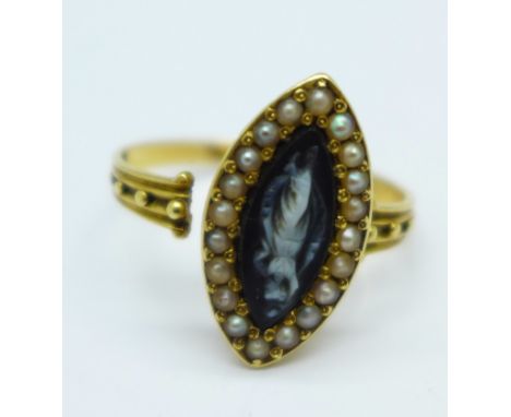 A 19th Century navette shaped yellow metal set cameo ring with seed pearls, shank requires repair, 4.0g