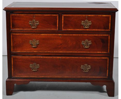 Mahogany chest of drawers, with Kingwood banding, fitted with two short and two long drawers, bracket feet.