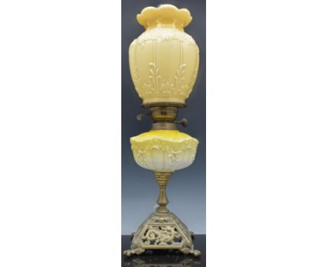 Victorian oil lamp, cast brass base, tinted and moulded glass reservoir and shade, complete with a chimney, 61cm.