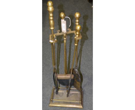 Brass fire companion, 72cm and three copper helmet shaped coal scuttles (4).