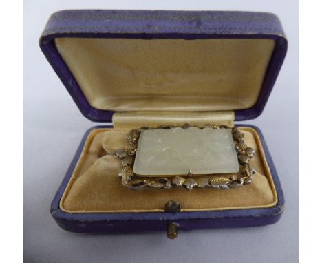 A Carved Jade Rectangular Brooch set in Gilt Metal Frame