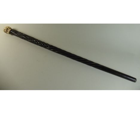 A Early 20th Century Carved Ebony Walking Stick with a Faux Ivory Knob Handle Modelled as a Human Skull. 86cms Long