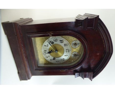 A Mahogany Cased Bracket Clock with Westminster Chime Movement by Junghans. Silvered Chapter Ring to Brass Face, Subsidiary D