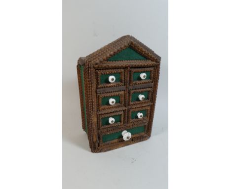 A 19th Century Tramp Art Spice Drawers with Typical Carved Decoration and Ceramic Handles. 30x20x10cms