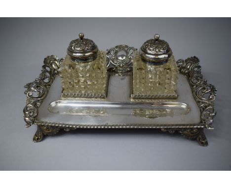 A Late 19th Century Silver Plated Desk Top Inkstand with Pen Rest and Two Glass Ink Bottles. Pierced Border and Four Scrolled