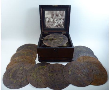 A Late 19th Century German Polyphon, Schutz Marke. The Hinged Lid with Inner Monochrome Print of Cherub Playing Music and Dan