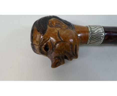 A 19th Century Continental Walking Stick carved Handle modelled as a Boys Head with Rolling Eyes. 88cm Long