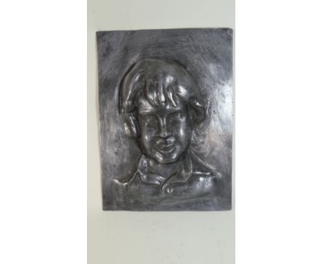 An Early 20th Century Sculpted Lead Portrait of a Young Man. 27x37cms