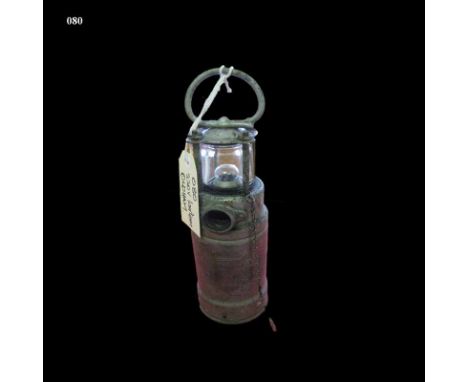 An Oldham 220V Lantern Patent No 16012, Automatic type, 220 V Direct Current Light house shape design Height: 33.5cm 