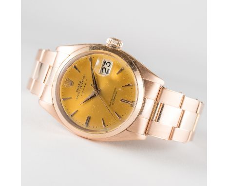 A RARE GENTLEMAN'S 18K SOLID PINK GOLD ROLEX OYSTER PERPETUAL DATE BRACELET WATCH CIRCA 1960, REF. 6534 D: Silver "honey" dia