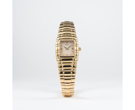 A LADIES 18K SOLID GOLD PIAGET TANAGRA BRACELET WATCH CIRCA 1990s REF. 45051 M 401 D 
D: Silver dial with Roman numerals &amp