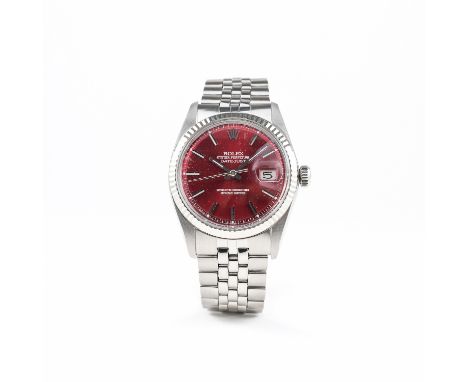 A GENTLEMAN'S STEEL &amp; WHITE GOLD ROLEX OYSTER PERPETUAL DATEJUST BRACELET WATCH CIRCA 1977, REF. 1601 
D: Red dial with s